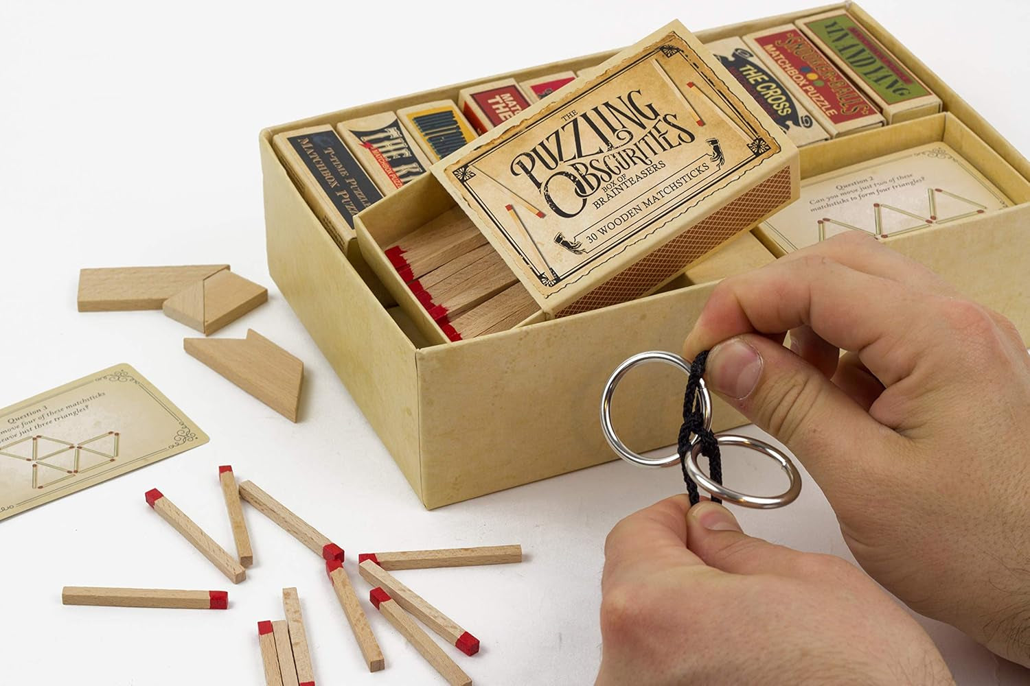 Puzzling Obscurities: 10 Matchbox Brainteasers & 50 Mind-Bending Challenges for Endless Fun!
